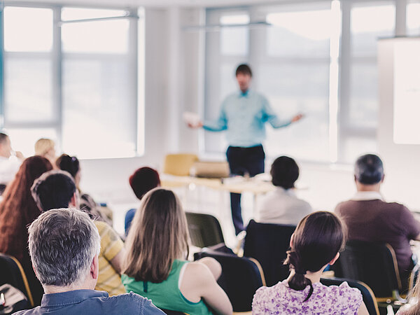 Speaker Giving a Talk at Business Meeting.